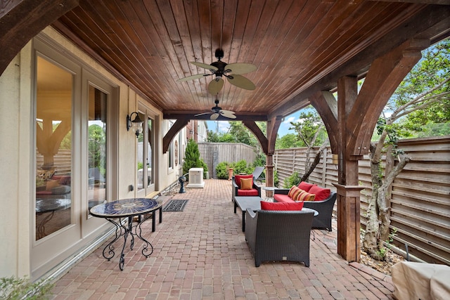 view of patio featuring outdoor lounge area, a ceiling fan, a fenced backyard, and cooling unit