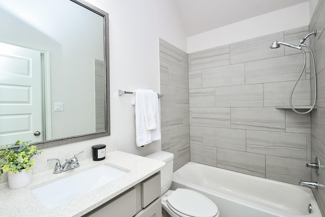 bathroom featuring toilet, shower / bath combination, and vanity