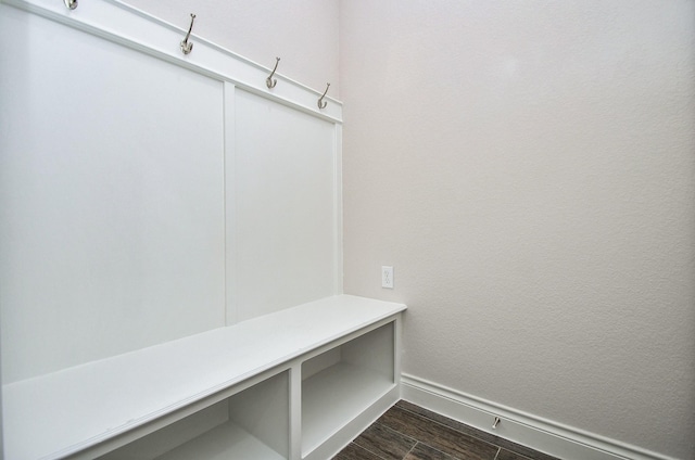 mudroom featuring baseboards and wood tiled floor