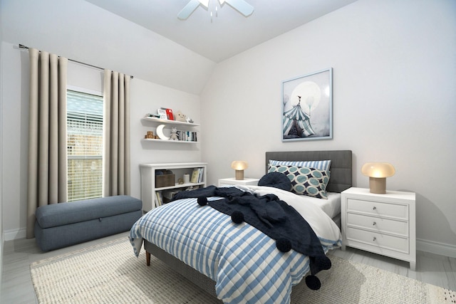 bedroom with baseboards, a ceiling fan, and lofted ceiling