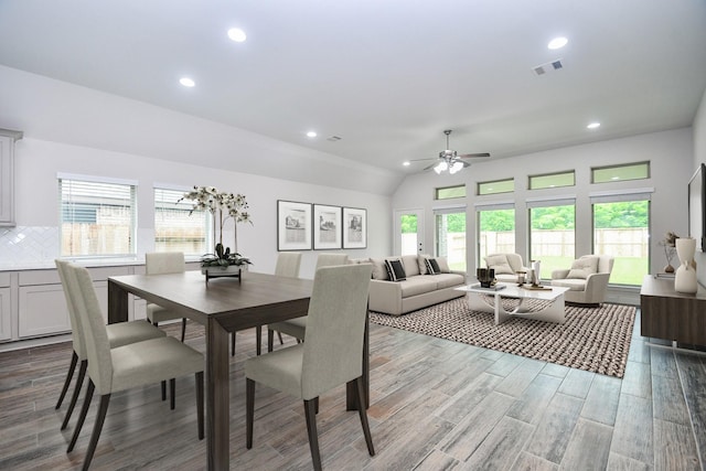 dining room with visible vents, ceiling fan, wood finished floors, and a healthy amount of sunlight