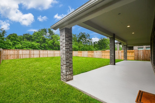 view of yard with a fenced backyard and a patio area
