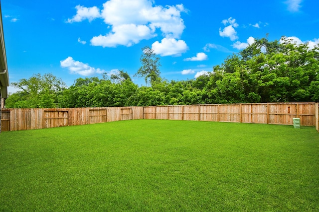 view of yard featuring a fenced backyard