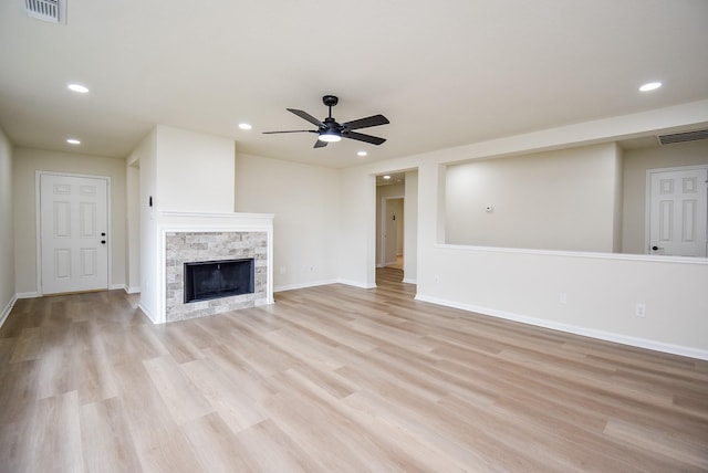 unfurnished living room featuring a ceiling fan, visible vents, light wood-style flooring, and recessed lighting