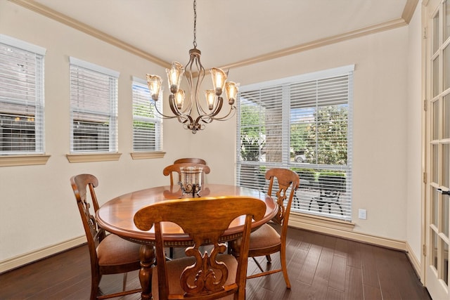 dining area featuring dark wood-style floors, baseboards, a notable chandelier, and ornamental molding