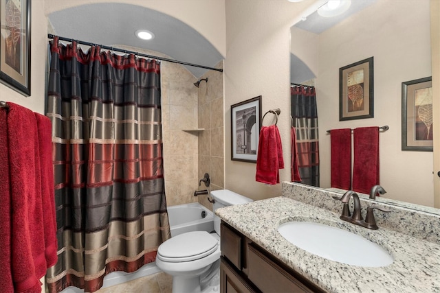 bathroom featuring toilet, tile patterned floors, shower / bath combo, and vanity