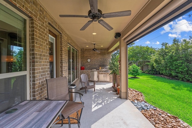view of patio / terrace with a ceiling fan, fence, grilling area, and area for grilling