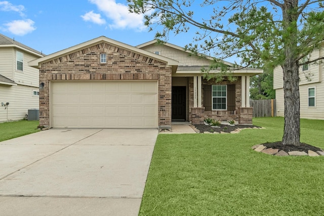 view of front of house featuring a garage, a front lawn, fence, brick siding, and driveway