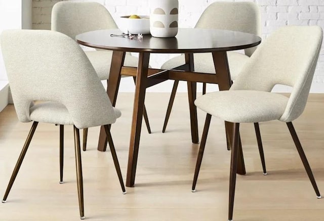 dining space featuring light wood finished floors