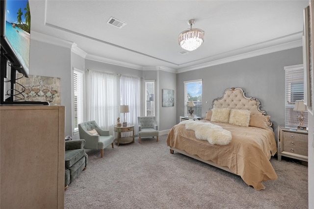 carpeted bedroom featuring ornamental molding, a chandelier, and visible vents