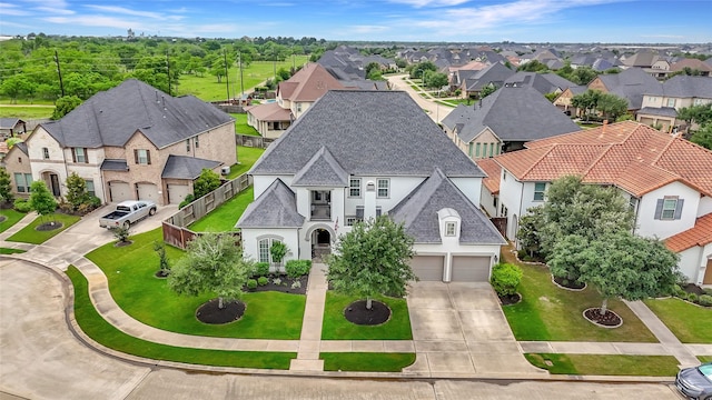 birds eye view of property with a residential view