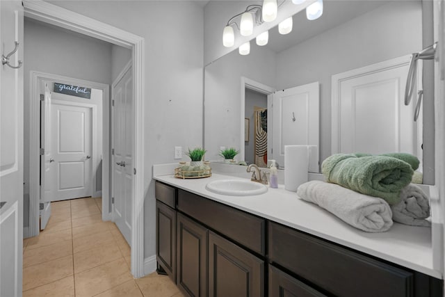 bathroom with tile patterned flooring and vanity
