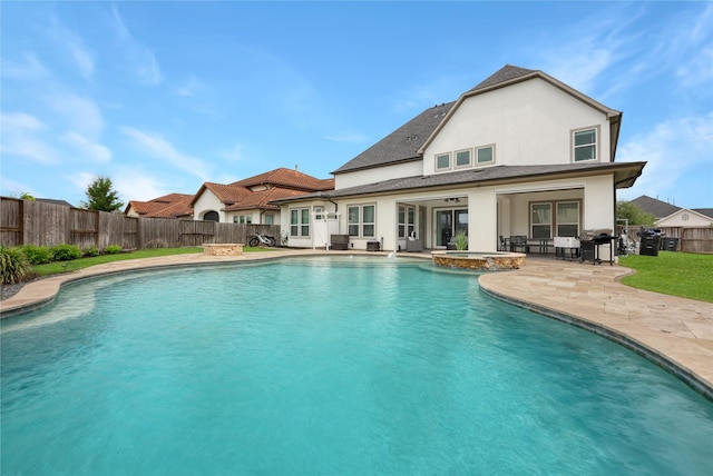 view of swimming pool with french doors, a pool with connected hot tub, a patio area, a fenced backyard, and a grill