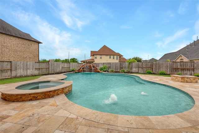 view of pool featuring a patio, a fenced backyard, and a pool with connected hot tub