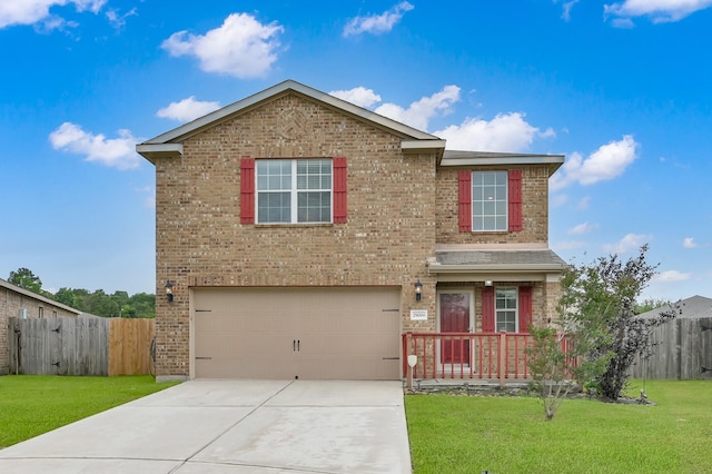 traditional-style house with a garage, brick siding, and driveway
