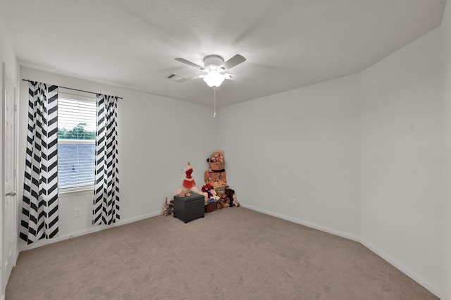 rec room with ceiling fan, carpet, and baseboards
