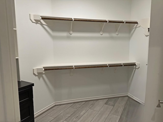 2112 Fm 3186 Unit 9, Onalaska, TX 77360 - walk in closet featuring light wood finished floors