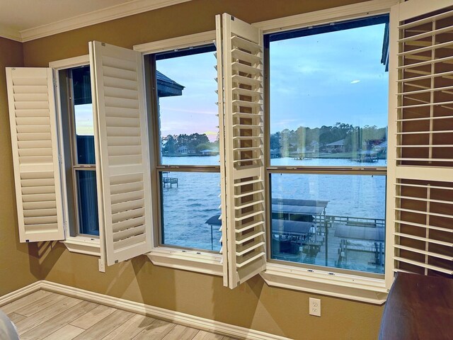 2112 Fm 3186 Unit 9, Onalaska, TX 77360 - entryway with baseboards, a water view, wood finished floors, and crown molding