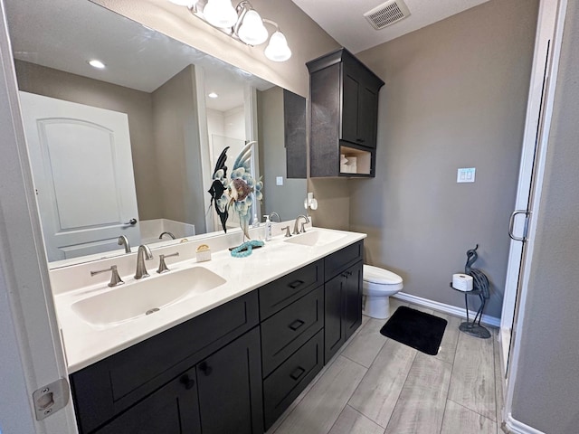 2112 Fm 3186 Unit 9, Onalaska, TX 77360 - full bathroom with double vanity, an enclosed shower, and wood finished floors