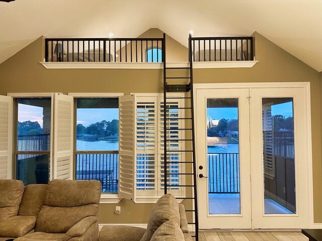2112 Fm 3186 Unit 9, Onalaska, TX 77360 - living area with lofted ceiling, wood finished floors, and baseboards
