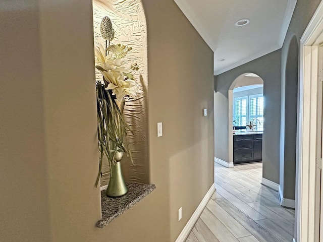 2112 Fm 3186 Unit 9, Onalaska, TX 77360 - hallway with arched walkways, crown molding, and baseboards