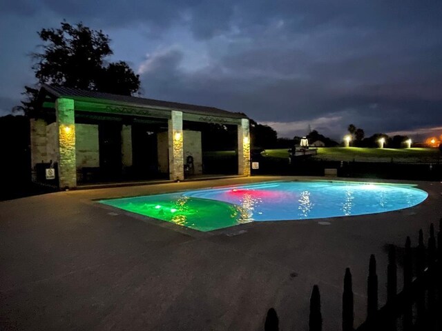 2112 Fm 3186 Unit 9, Onalaska, TX 77360 - pool at twilight with a patio and an outdoor pool