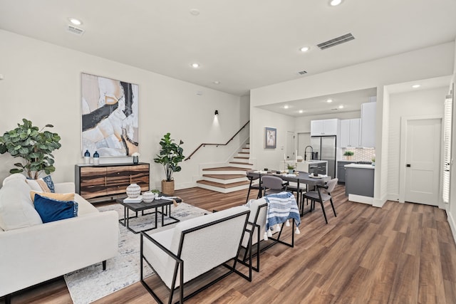 881 Rachel St Unit F, Houston, TX 77091 - living area with recessed lighting, visible vents, wood finished floors, and stairway