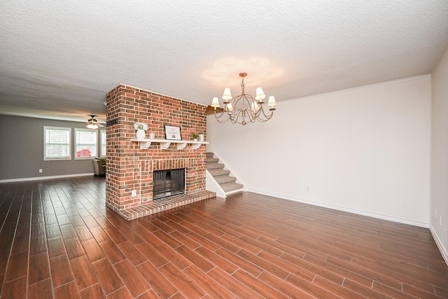 unfurnished living room featuring baseboards, a textured ceiling, and dark wood-type flooring