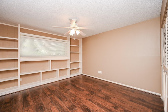 unfurnished room featuring a textured ceiling, baseboards, a ceiling fan, and wood finished floors