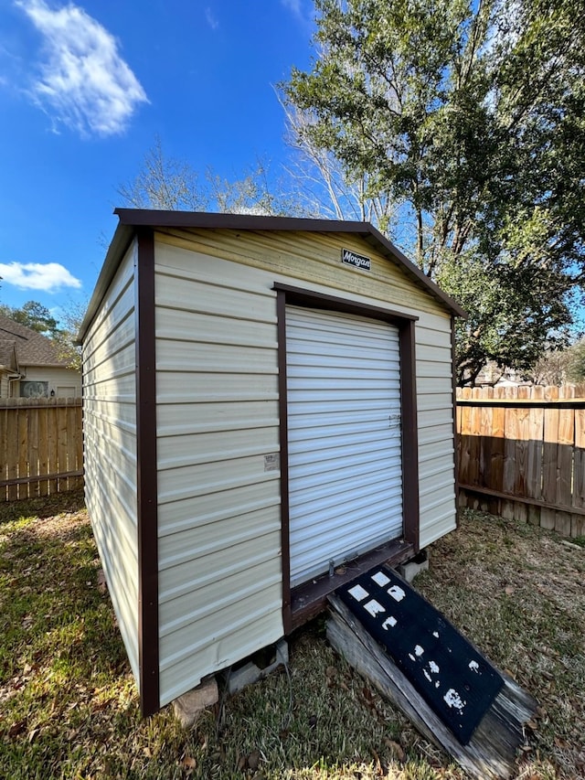 view of shed with fence