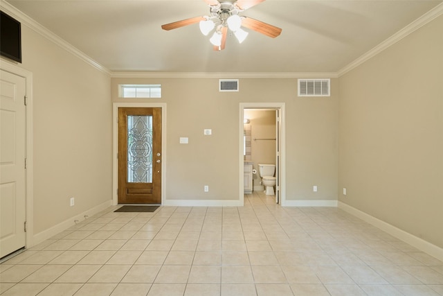 foyer with crown molding, ceiling fan, and visible vents
