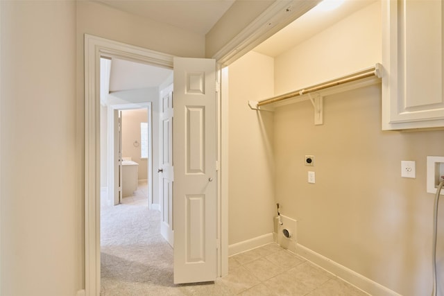 laundry room with washer hookup, laundry area, electric dryer hookup, light tile patterned floors, and baseboards