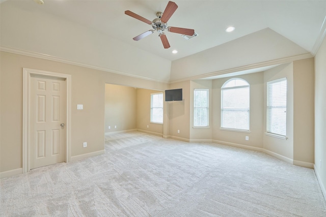 unfurnished room featuring light colored carpet, baseboards, ceiling fan, and lofted ceiling