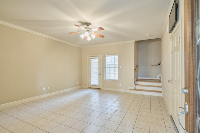 foyer entrance featuring crown molding, stairs, light tile patterned flooring, baseboards, and a ceiling fan