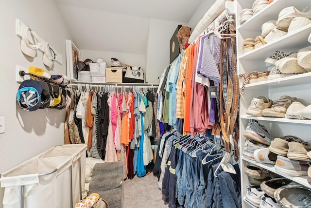 walk in closet with carpet flooring