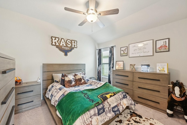 carpeted bedroom featuring a ceiling fan and lofted ceiling