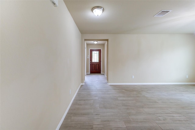 interior space with baseboards and visible vents