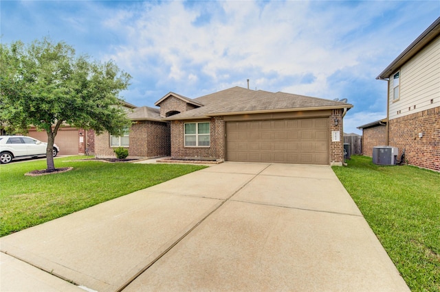 ranch-style home with a garage, a front yard, cooling unit, brick siding, and driveway