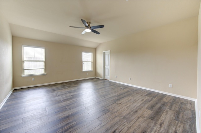 empty room featuring baseboards, a ceiling fan, and dark wood-style flooring