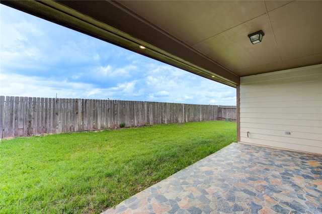 view of yard featuring a fenced backyard and a patio