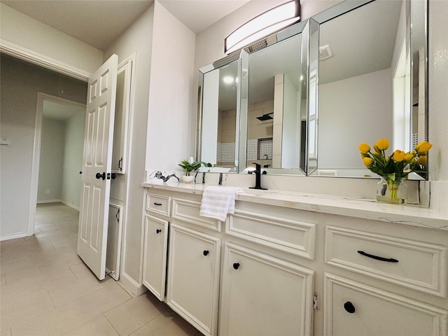 bathroom featuring vanity and tile patterned flooring