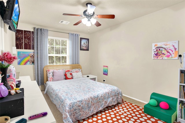 7035 Primrose Rd, Baytown, TX 77521 - carpeted bedroom featuring baseboards, visible vents, and ceiling fan