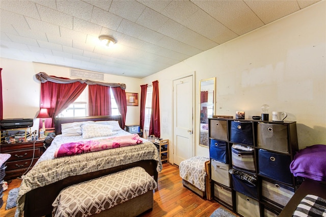 bedroom featuring wood finished floors