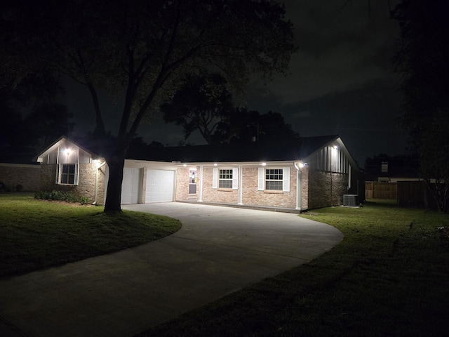 12406 Whittington Dr, Houston, TX 77077 - view of front of home with a garage, fence, cooling unit, concrete driveway, and a lawn