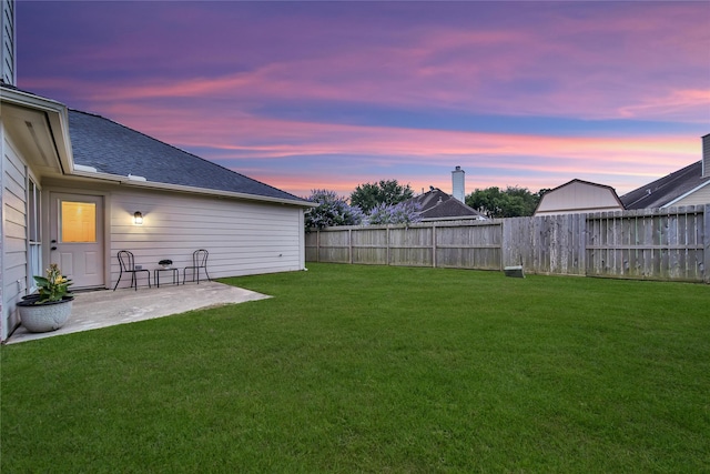 view of yard with a patio and a fenced backyard