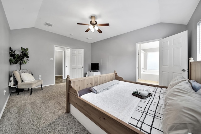bedroom with baseboards, visible vents, carpet flooring, and lofted ceiling