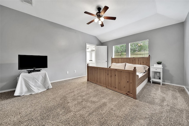 carpeted bedroom featuring a ceiling fan, baseboards, visible vents, and lofted ceiling