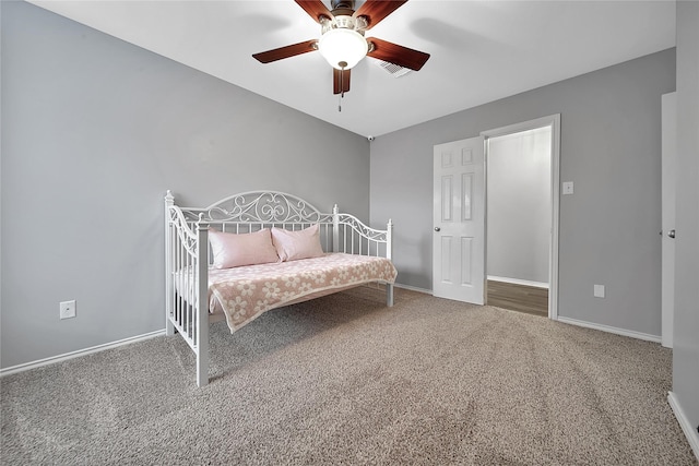 bedroom featuring baseboards, carpet, a ceiling fan, and visible vents