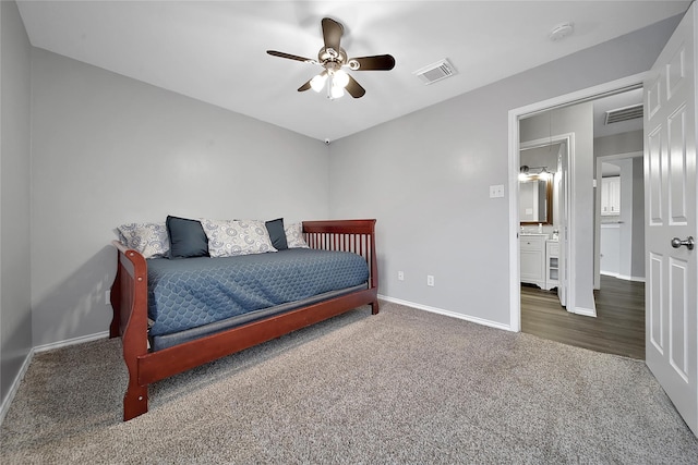 carpeted bedroom with baseboards, ceiling fan, and visible vents