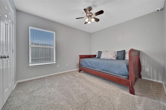 bedroom with carpet floors, baseboards, and a ceiling fan